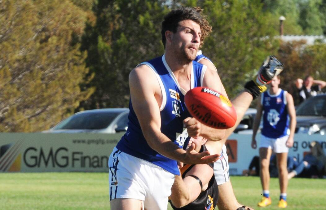 HANDBALL: Donald's Charles Murrie gets off a handball despite close attention earlier in the season. Picture: BULOKE TIMES