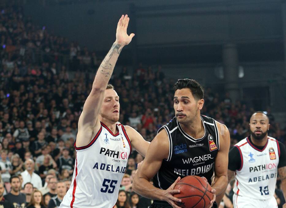ON GUARD: Mitch Creek tries to stop Melbourne United's Tai Wesley from getting to the basket in front of a packed Hisense Arena on Saturday night. Picture: AAP IMAGES