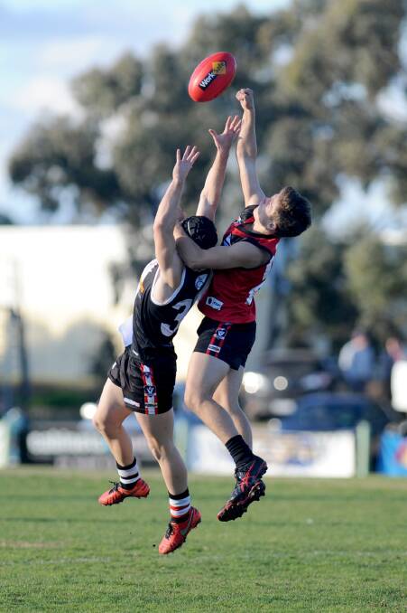 PUNCH: Stawell's Jesse Barber climb's over the top of Horsham Saints' player Kieren Priestley to spoil in his side's round seven win. Picture: SAMANTHA CAMARRI