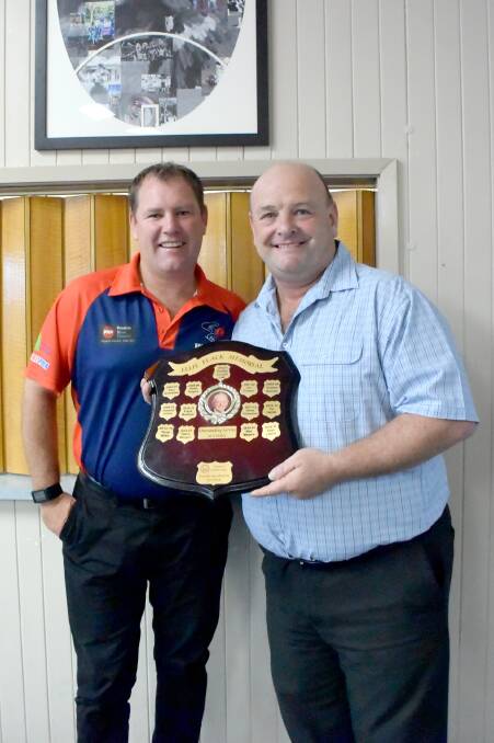 Horsham Cricket Association president Tim Hopper presents Dean Lawson the Ellie Flack memorial award.