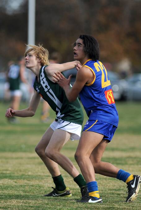 CONTEST: Jayden Wright in a contest for the Wimmera-Mallee against Hampden's Jack Hookway earlier in 2016. Picture: SAMANTHA CAMARRI