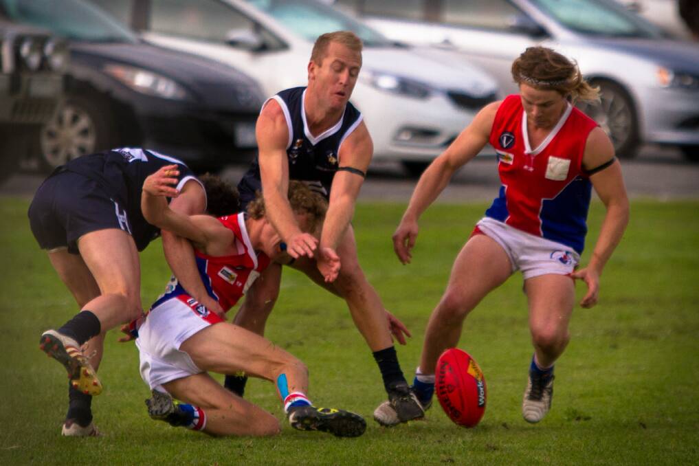 CONTEST: St Arnaud's Jake Tillig goes to ground to get a hard ball against Charlton as teammate Nick Baldwin arrives on the scene to collect possession. Picture: JASON SMITH