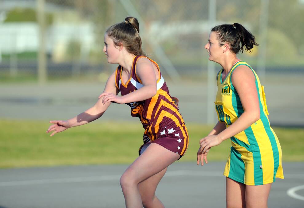 IN FRONT: Warrack's Prani May gets front position against Dimboola's Beth Doherty when the side's last met in round 11. Picture: PAUL CARRACHER