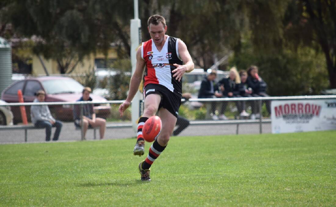 BOOT: Stuart Mills gets boot to ball for the Horsham Saints' reserves side in its second semi-final loss against Minyip-Murtoa. Picture: RILEY KEEL