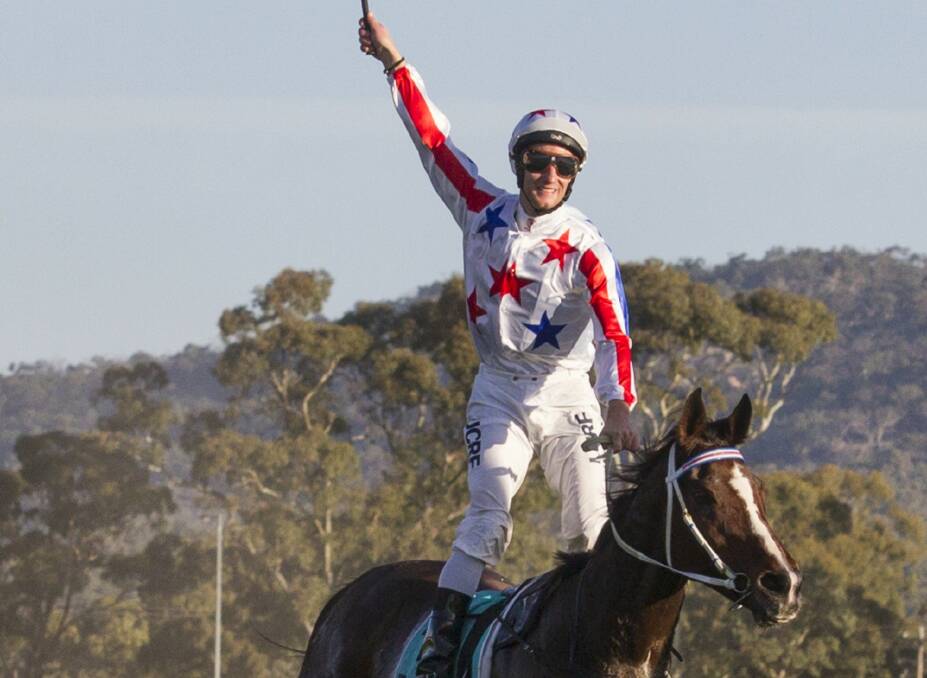 Jack Hill salutes to the crowd as he crosses the line on Mujadale to a win in the cup.