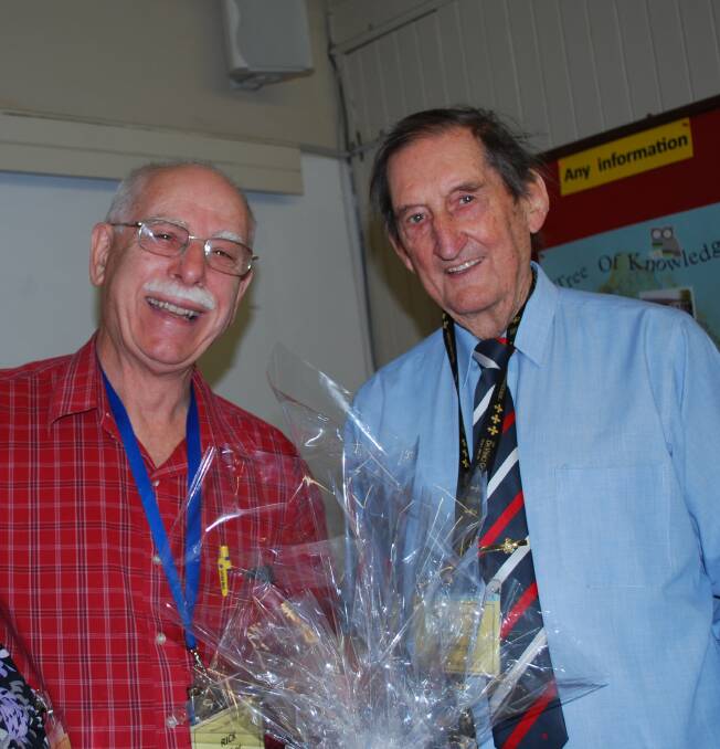 GREAT YEAR: U3A treasurer Rick Walker presents a gift to president Bob McIlvena in recognition of his tireless work.