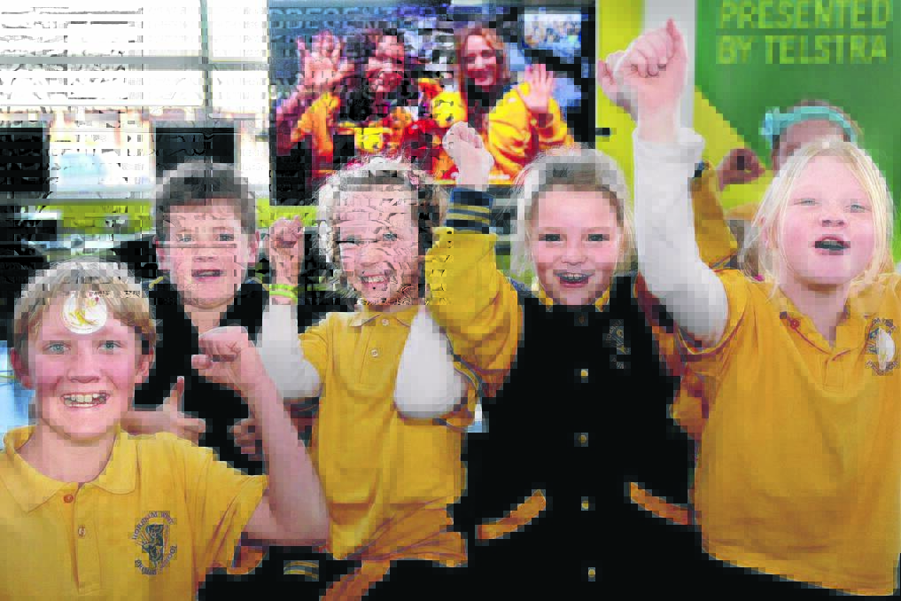 GO AUSSIE GO: Horsham West Primary School students Brayden Grant, 12, Jack Hickmott, 10, Molly Young, 9, Bailey Walsh, 9, and  Lauren Plunkett, 8, enjoy a chat with Olympians Sarah Bombell and Eloise Amberger, on the screen. Picture: SAMANTHA CAMARRI