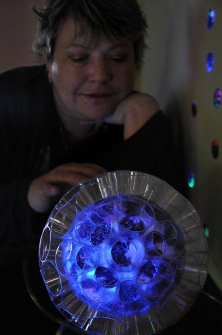 BLUE LIGHT: Belinda Eckermann shows a light installation 'Transgenic Canola' as part of her art exhibition which will debut at Rainbow tomorrow. Picture: CONTRIBUTED
