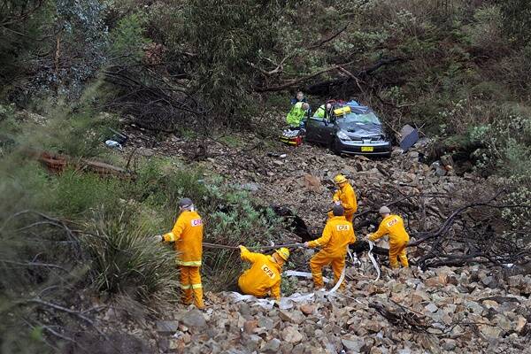 RESCUE: The car at the bottom of a ravine.