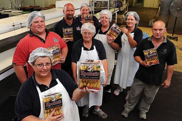 SAVE OUR JOBS: Kooka’s Country Cookies staff are pictured, front from left, Debbie Romeo, Dwain Dempsey and Barb Fox; back, Travis Hickmott, Fag Moloney, Glenda House, Bernie Abbott and Stephen Blake. The factory is in danger of closing. Picture: PAUL CARRACHER