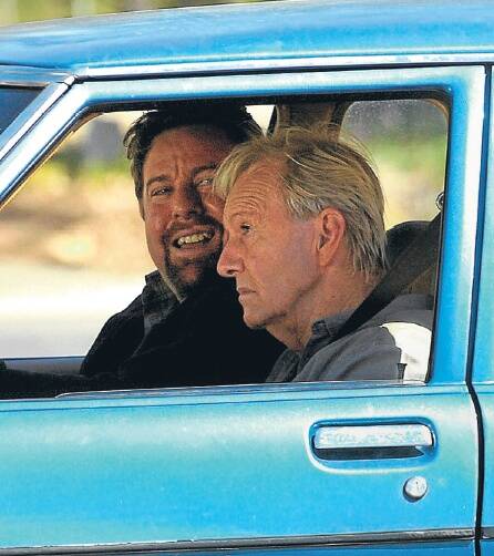STARS: Famous Australian actors Shane Jacobson and Paul Hogan film a scene for their new movie Charlie and Boots at Dadswells Bridge on Monday. Pictures: PAUL CARRACHER