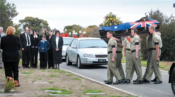 AUSTRALIAN SOLDIER: Private Phillip Boschen’s family watch as Lance Corporal Adam Churchward, Private David Longmire, Private Jake Sims, Lance Corporal Dallas Cameron, Private John Brazendale and Private Lachlan Frankland carry the soldier’s casket. Pictures: MELISSA POWELL
