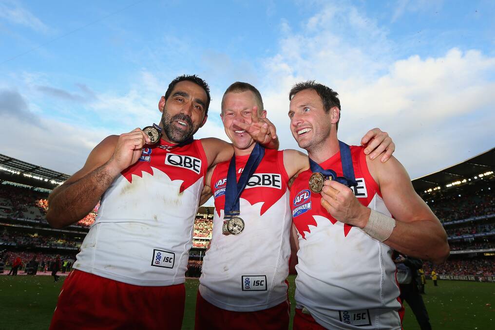 Horsham's Adam Goodes, left, celebrates his second AFL premiership with Sydney Swans team-mates Ryan O'Keefe and Jude Bolton. Picture: GETTY IMAGES