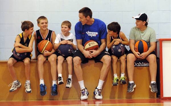 CALL UP: Horsham basketball export and Adelaide 36s player Mitch Creek has been selected in the Australian Boomers squad. He is pictured with Horsham juniors, from left, Sean McKenzie, Josh Bibby, Jack Willie, Dane Stewart and Connor McKenzie at a clinic at Horsham Basketball Stadium last month. Picture: PAUL CARRACHER