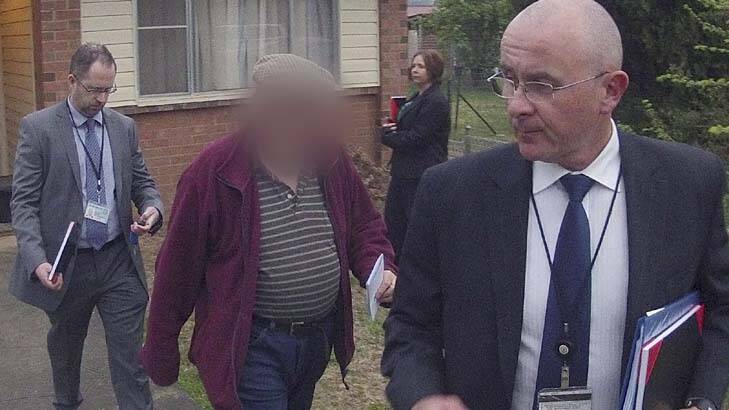 Arrested … detectives with Father F in Armidale yesterday. He faces 25 child sex abuse charges.