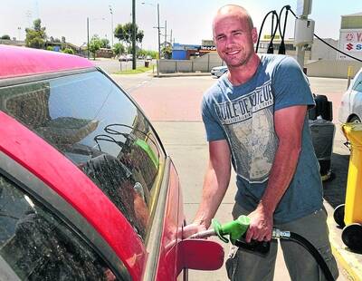 FUEL for thought: Natimuk Road resident Ian McCulloch fills his car at a Horsham petrol station on Monday afternoon.