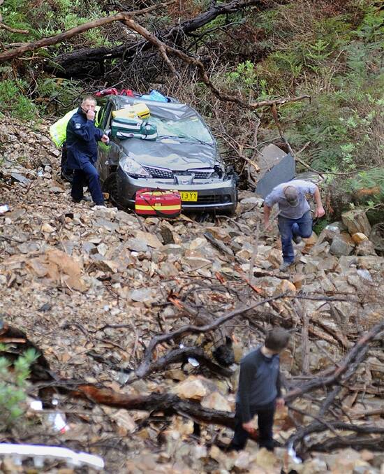 RESCUE: The car at the bottom of a ravine.
