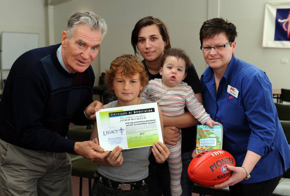 Wimmera Legacy President Bill McGrath presents a certificate of appreciation to Jaykob McCallum, 10. They are pictured with Jaykob's mum Vanita Dinsdale, brother Rhiese Gray and Kmart Horsham's Raegen Donald. Picture: PAUL CARRACHER