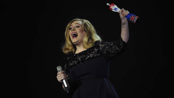 Getting her hands on another British icon ... Adele celebrates with the British Album of the Year award for her album "21" at the BRIT Awards 2012 in February.