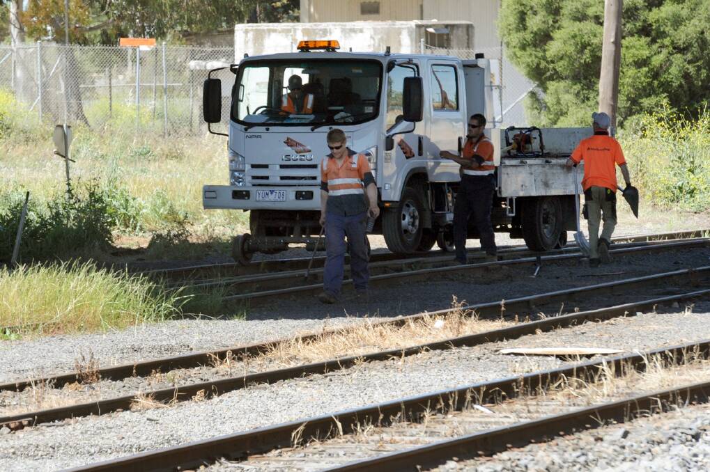 PREP WORK: Workers from McLeod Rail repair siding rails at Horsham Railway Station this week. Picture: PAUL CARRACHER