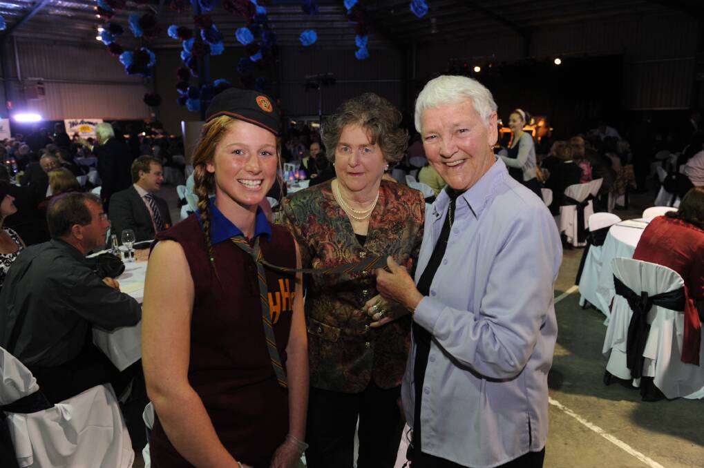 HISTORY COLLIDES: Horsham College student Keziah Freeman, dressed in a uniform from the college s 100 year history, is pictured with former Horsham High School students Nancy McGrath and Margaret Ladlow at a centenary gala dinner on Saturday night. Nancy and Margaret were classmates from 1946 to 1948. Pictures: PAUL CARRACHER