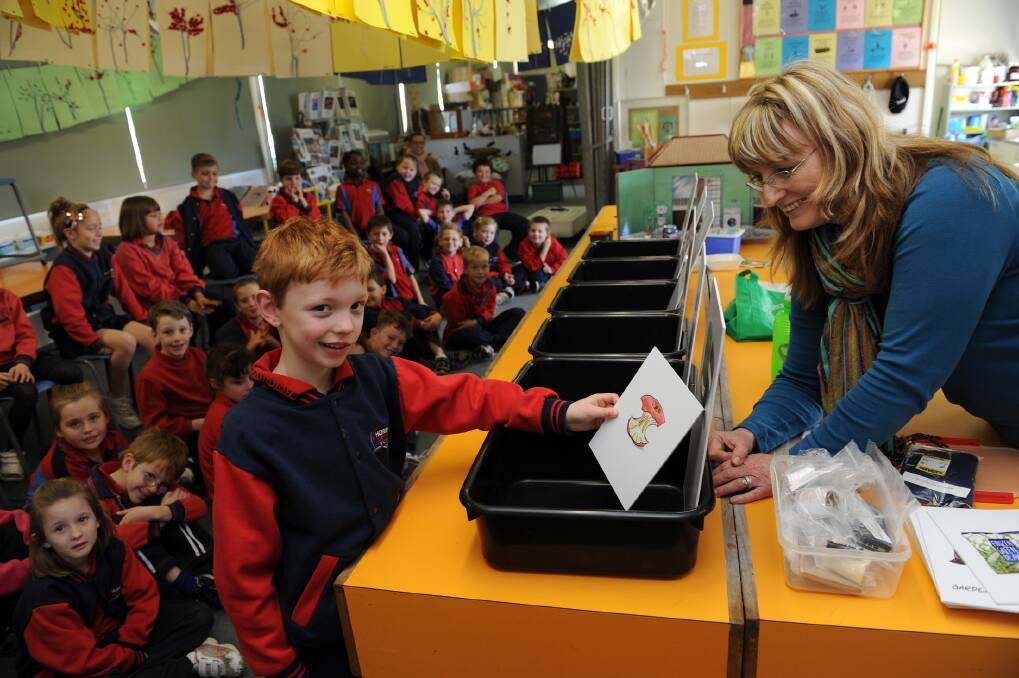Horsham Primary School 298 campus student Riley Sturrock places an apple core in the correct recycling bin during a sustainability presentation from LaVergne Lehmann of Grampians Regional Waste Management Group. Picture: PAUL CARRACHER