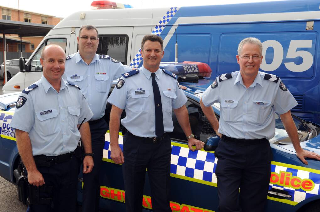ROAD TOLL FOCUS: Assistant Commissioner Robert Hill, centre, visited Horsham Police Station on Tuesday, where he met Horsham Highway Patrol members Senior Constable Michael Ryan, left, Leading Senior Constable Greg Lambert and Sergeant John McTaggert.  
Picture: PAUL CARRACHER