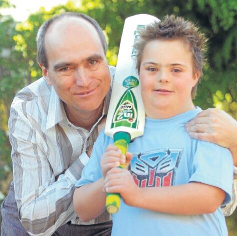 GREAT LOVE: Dr Bernhard Moeller with his son Lukas, 13, in Horsham yesterday. Lukas loves playing cricket and speaks with a perfect Aussie accent. Picture: PAUL CARRACHER