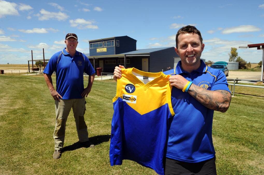 Dylan Wright, front right, with Natimuk Football Club president Travis Maybery, left. Wright has been appointed playing coach of the Rams for 2013. Picture: PAUL CARRACHER