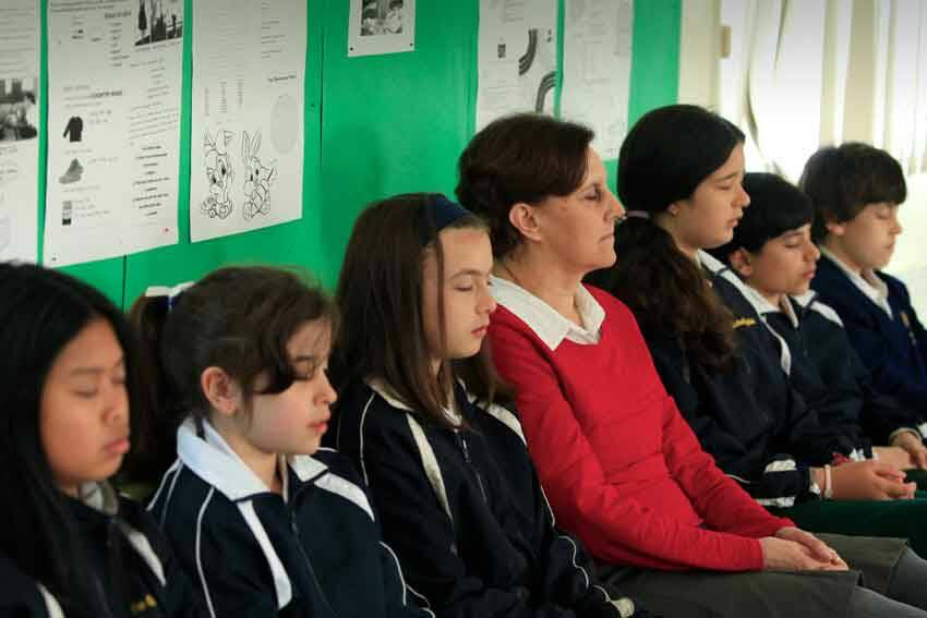 Students practise transcendental meditation at the Maharishi School in Reservoir.
