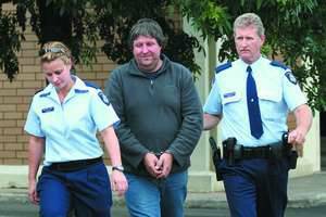 COURT DATE: Mark Weaver is lead into Horsham Magistrate's Court by Constable Belinda Ryan and Constable Dennis Foster.