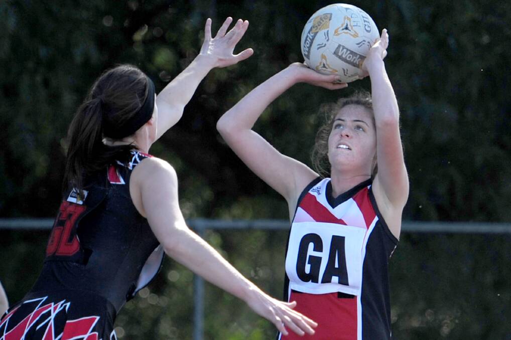 Edenhope-Apsley's Georgia McLennan lines up for a goal as Noradjuha-Quantong's Fiona Rowe defends in Saturday's second semi-final. Picture: SAMANTHA CAMARRI