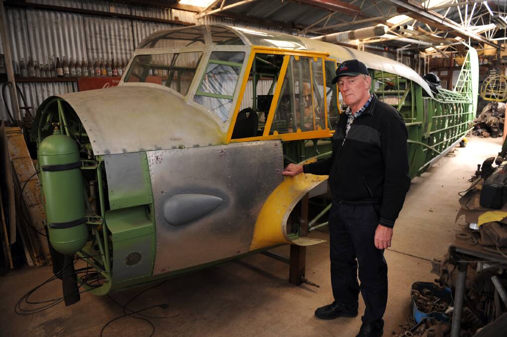 Rob Lynch with the hull of an Avro Anson training plane being restored at Nhill.