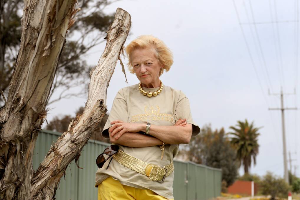 READY TO SNAP: Nhill resident Helen Woodhouse-Herrick is unimpressed by the way trees have been lopped in the town. 
Picture: SAMANTHA CAMARRI
