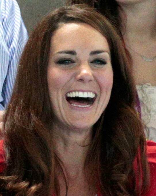 Finally a smile from the Duchess of Cambridge at the swimming finals in London.