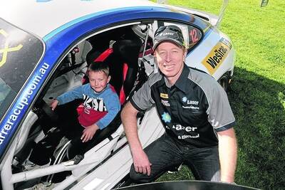 READY SET GO: Tate McKerron, 5, in the hot seat of Steve Richards' racing car at West Side Tabaret.Picture: PAUL CARRACHER