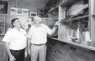 HISTORY: Life members Kevin Budde and Ron Hanna peruse Horsham Angling Club’s extensive memorabilia collection.
