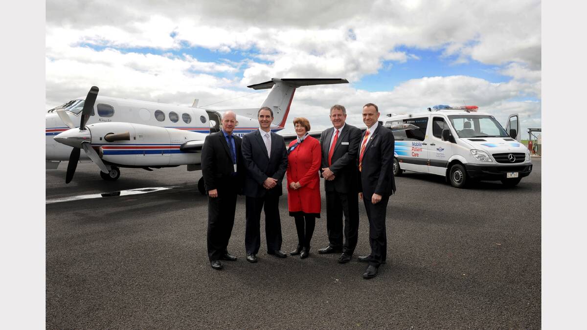 Royal Flying Doctor Service Victoria chief executive Scott Chapman, Wimmera Health Care Group deputy chairman Dean Luciani, service board member Robyn Lardner, Horsham Mayor David Grimble and health group chief executive Chris Scott celebrate the new agreement. Picture: SAMANTHA CAMARRI