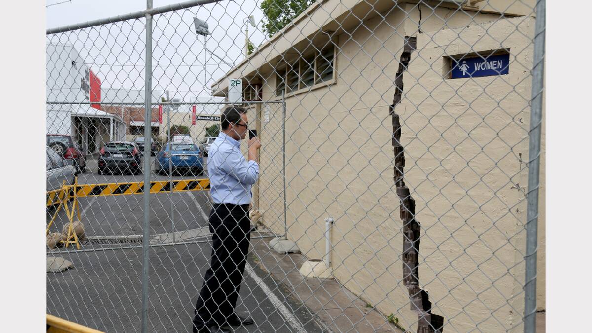 CHIP OFF THE OLD BLOCK: Horsham Rural City Council building  inspector Peter Kolev examines damage at the town hall carpark toilet  block. Picture: THEA PETRASS