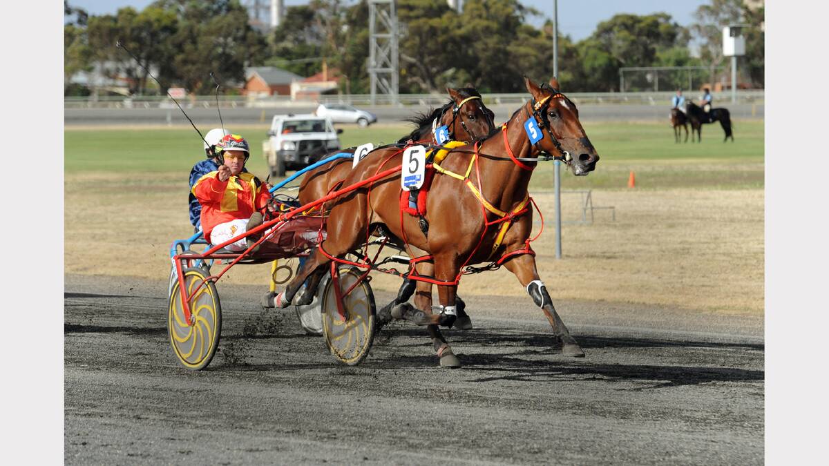STEAMING ALONG: Glen Craven, front, drives Keayang Steamer to victory in yesterday’s Wimmera Mail-Times Horsham Pacing Cup ahead of last year’s winner Smoken Up, trained and driven  by Lance Justice. Picture: PAUL CARRACHER