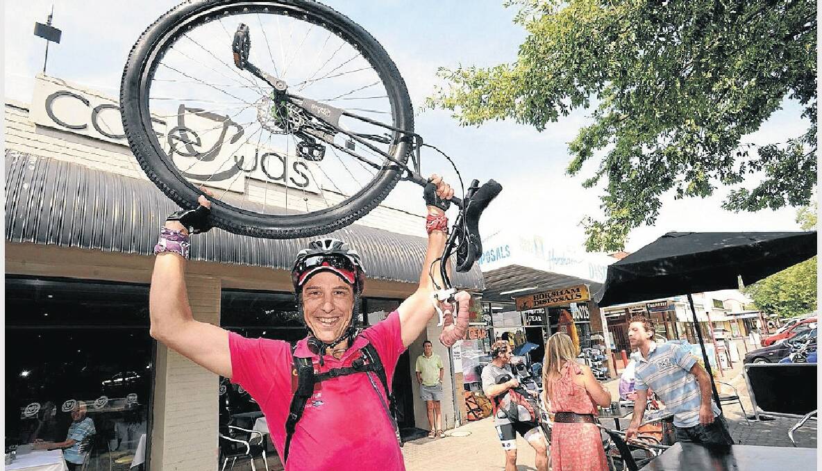 CYCLING SUCCESS: Samuel Johnson celebrates another day on his unicycle as he arrives in Horsham on Wednesday. PICTURE: PAUL CARRACHER.
