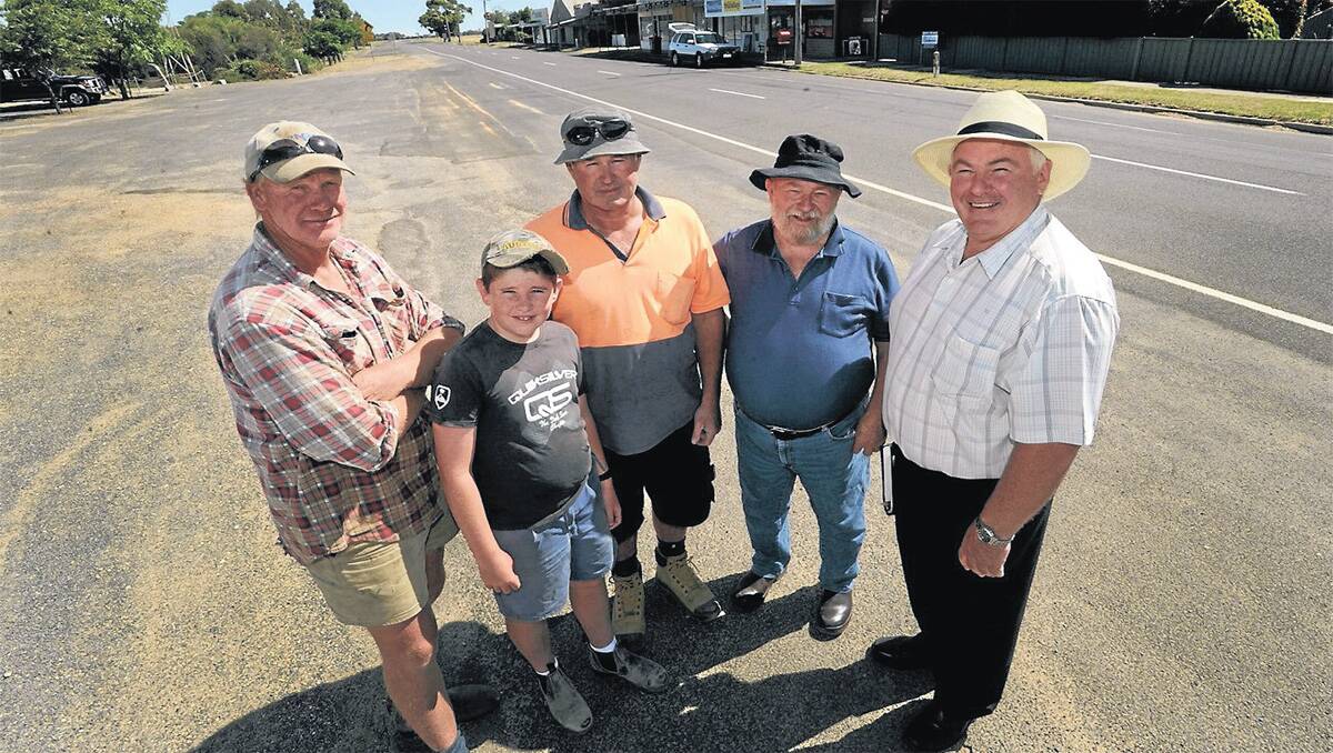 MAIN STREET: Marnoo residents Peter Cameron, Angus Johnson and father Doug Johnson, Griffith ‘Chips’ Fearon and Northern Grampians Shire councillor Kevin Erwin support the town’s battling community spirit. Picture: PAUL CARRACHER