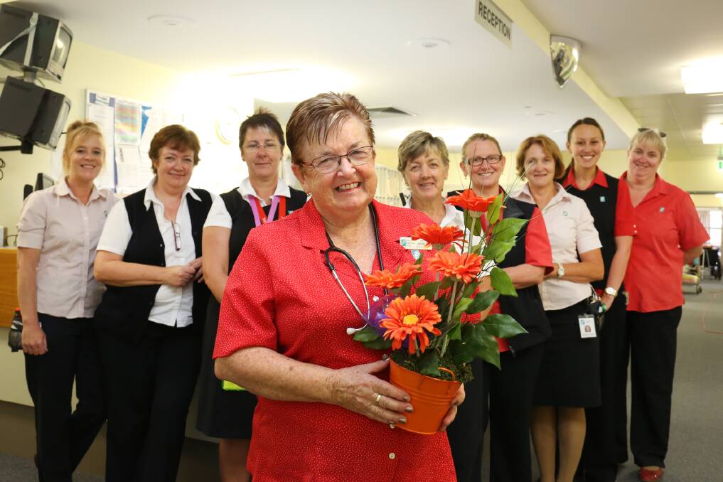 FAREWELL: Horsham nurse Jan Aisbett, centre, celebrates her last day at work after 50 years of nursing alongside Wimmera Base Hospital colleagues, from left, Suzie Timms, Cathy Lane, Vicki Arnott, Jenny Ellis, Sheena Kirby, Marg McDonald, Lucy Virtue and Jenny Vague. Picture: THEA PETRASS