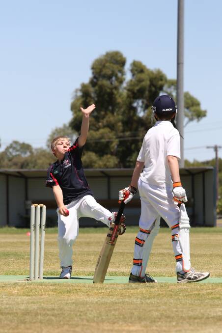TIGHT BOWLING: Dan Polack, left, sent down two maidens in Horsham's under-14 Country Week match against West Wimmera at Davis Park in Nhill. Picture: THEA PETRASS