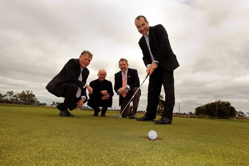 Sports minister James Merlino sinks a $1 million putt into Horsham Golf Club redevelopment. John Konings, Brian Thomas and Hugh Delahunty cheer him on. 