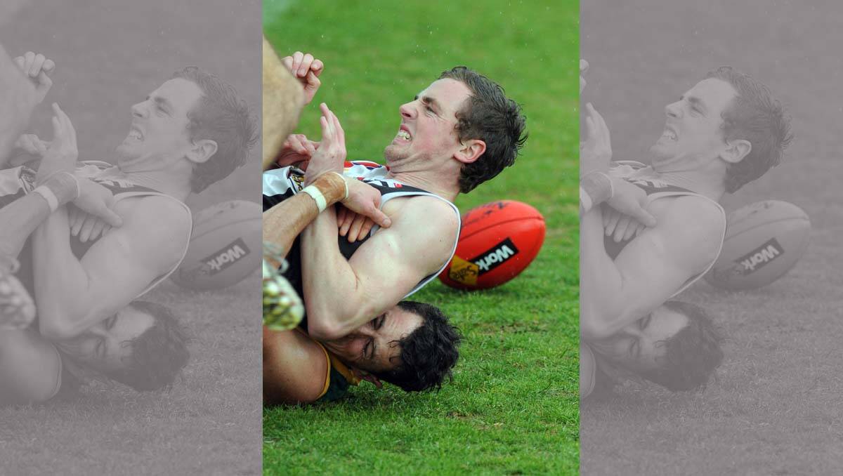 Addison Milner tackled by Clancy Bennett. Wimmera Football League grand final at Davis Park, Nhill. 
