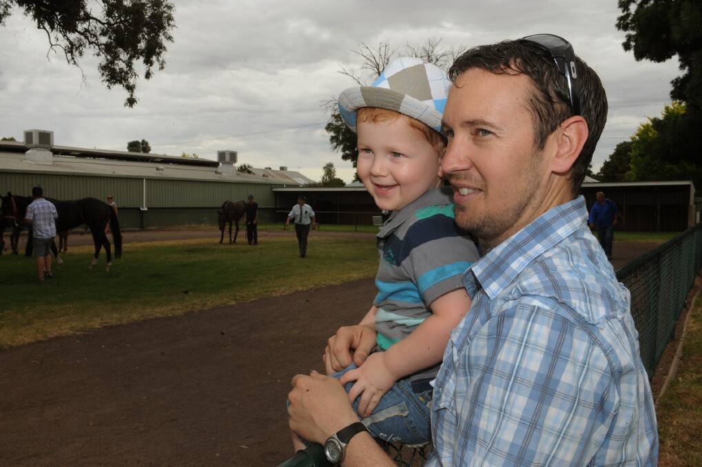 Jed Rudge, 3, and Peter Rudge at Santa Day Races at Horsham. 