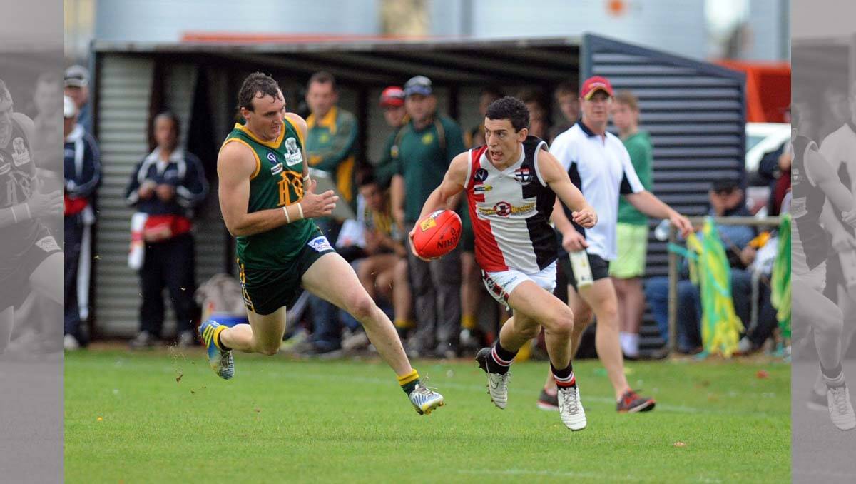 Conor O'Beirne tries to evade Nigel Sibson. Wimmera Football League grand final at Davis Park, Nhill. 