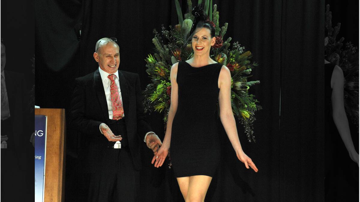 Neil Grigg with Danielle Grindlay modeling Neil Grigg fashion. Neil Grigg, James Penrose Fashion Show in Harrow. 