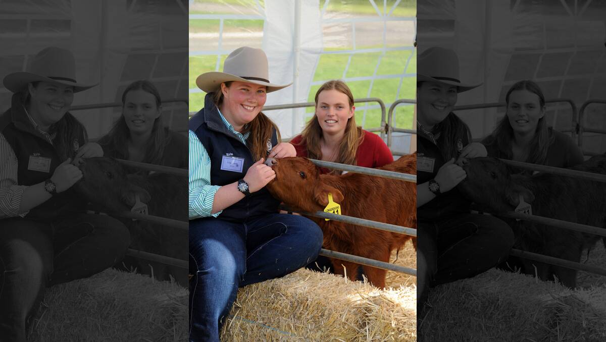 Erin Arnott and Ellie Perryman with calf at Longy open day. 